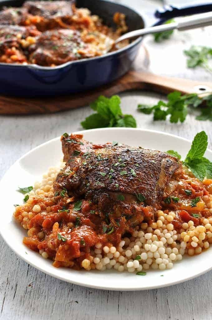 Syrian Chicken with Giant Couscous on white plate