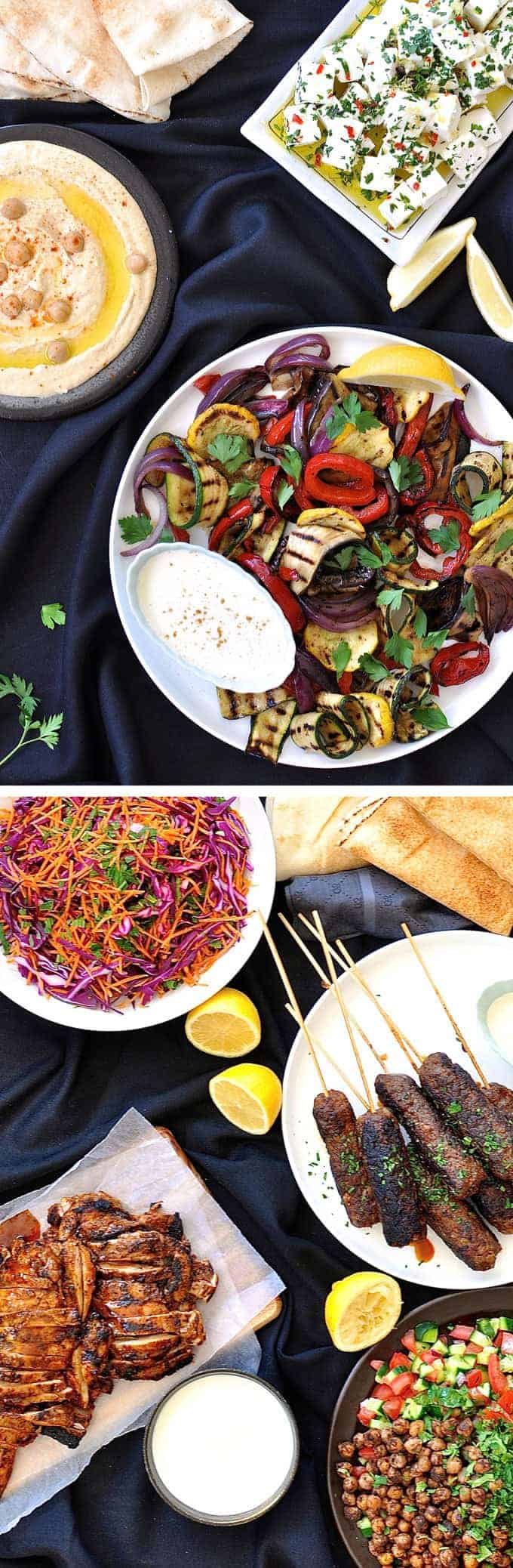 Table filled with dishes for an Arabian Feast / Middle Eastern Menu, with dishes including Chicken Shawarma, lamb kaftas, hummus, chickpea salad.