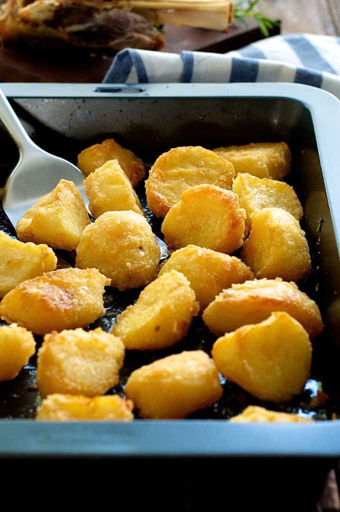 Truly Crunchy Roast Potatoes - this has a really thick, crunchy crust! Par boil, rough up the surface, dust with semolina then bake in a very hot oven in preheated oil. Based on a Nigella recipe.