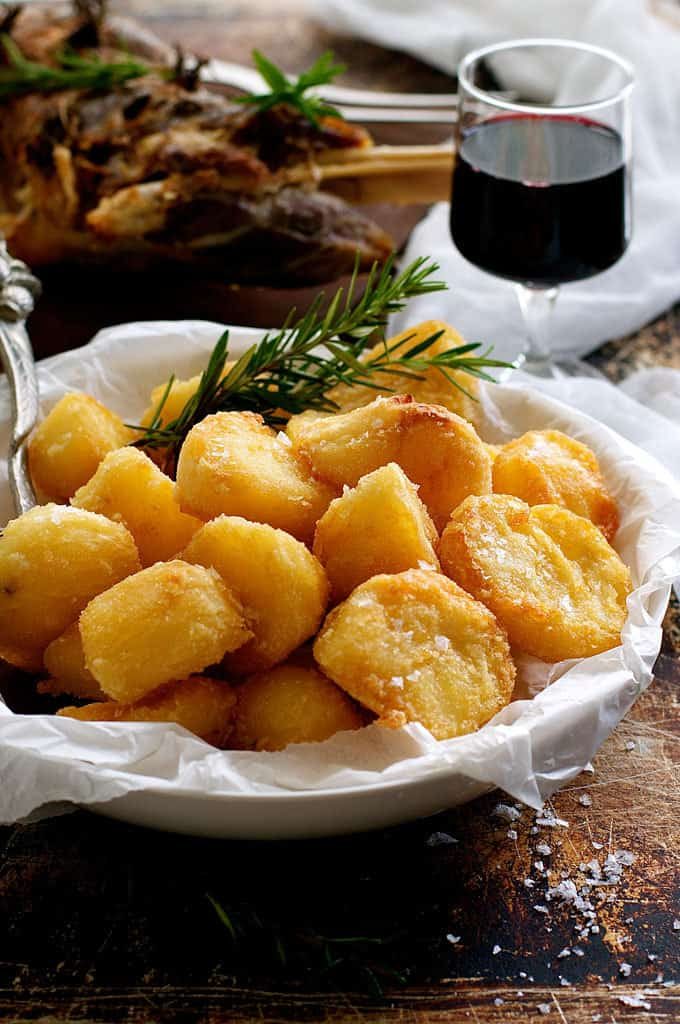 Truly Crunchy Roast Potatoes - par boil, rough up the surface, dust with semolina then bake in a very hot oven in preheated oil. Based on a Nigella recipe.