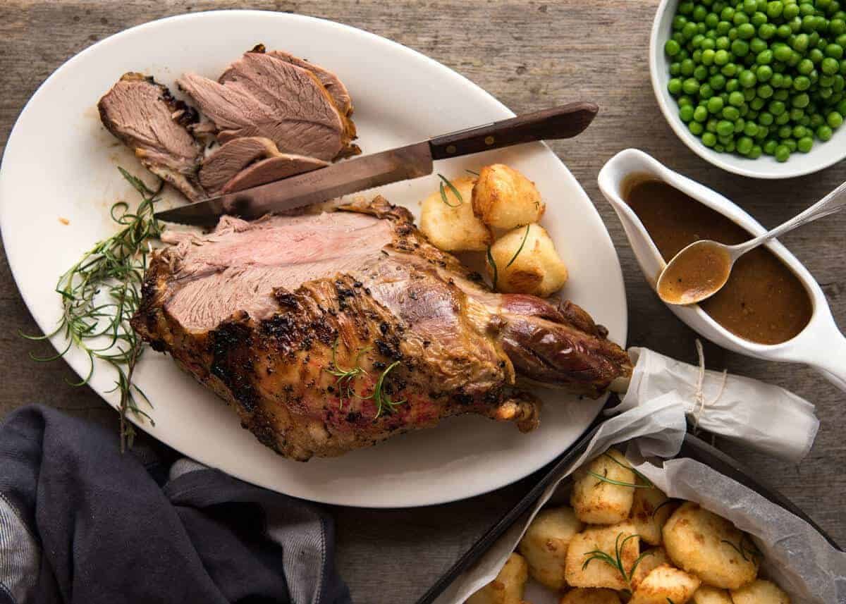 A classic, perfectly cooked Roast Lamb Leg with a classic smooth, rich gravy. It's Lambalicious! recipetineats.com