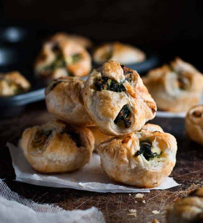 A pile of Ricotta and Spinach Puff Pastry Bites