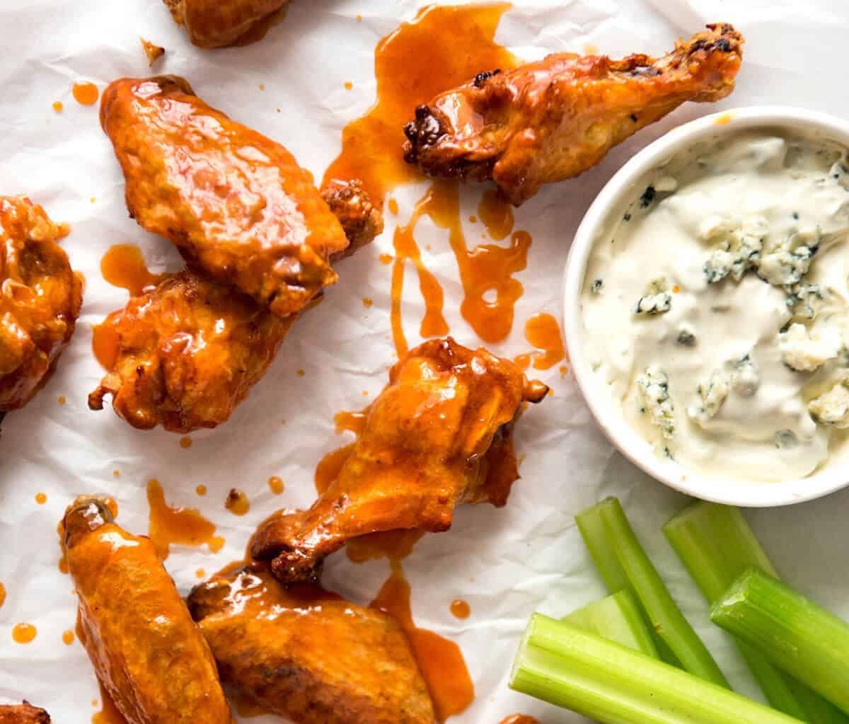 Truly Crispy Oven Baked Buffalo Wings - no false promises here, these wings are seriously crispy and unbelievably easy to make. Tossed in a classic Buffalo Sauce and served with blue cheese sauce. Watch the recipe video to HEAR just how crispy these are! recipetineats.com