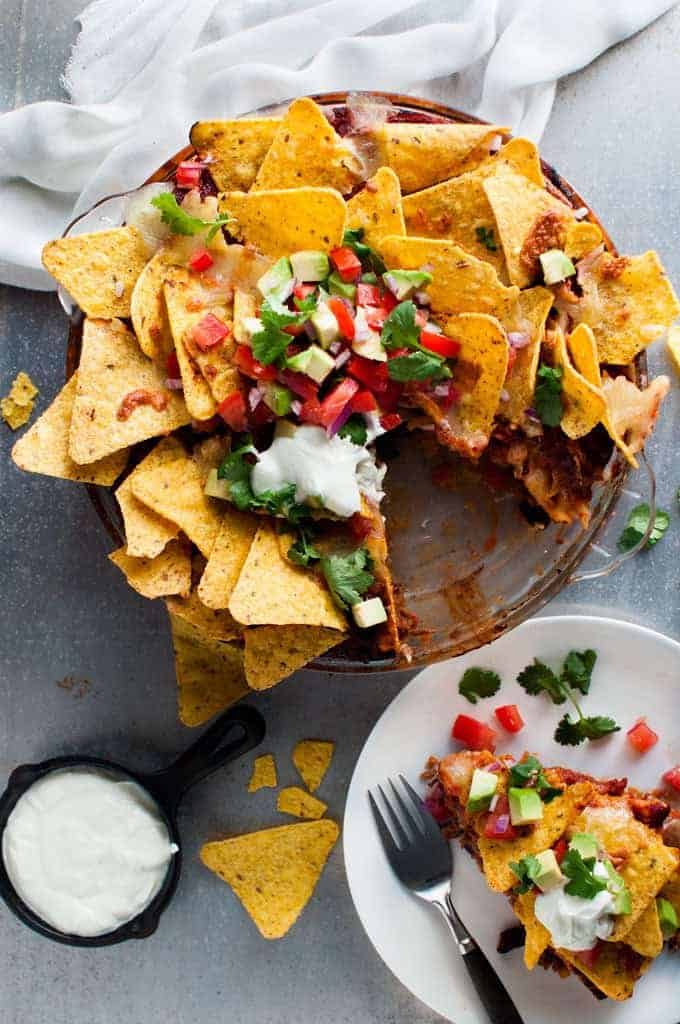 Nachos Pie with tomato and avocado salsa