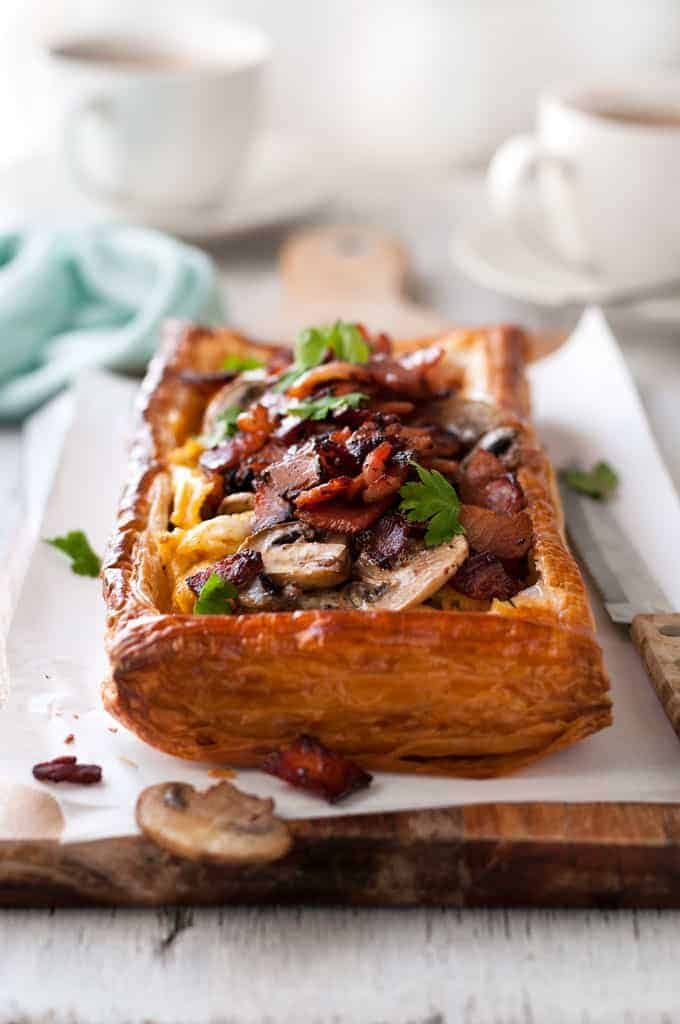 Bacon, Egg and Mushroom Tart on a wooden board