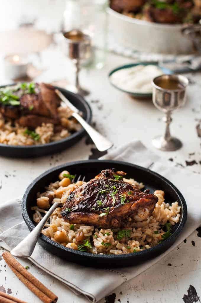 Baked Chicken Shawarma and Rice in a small cast iron serving dish, ready to be eaten.