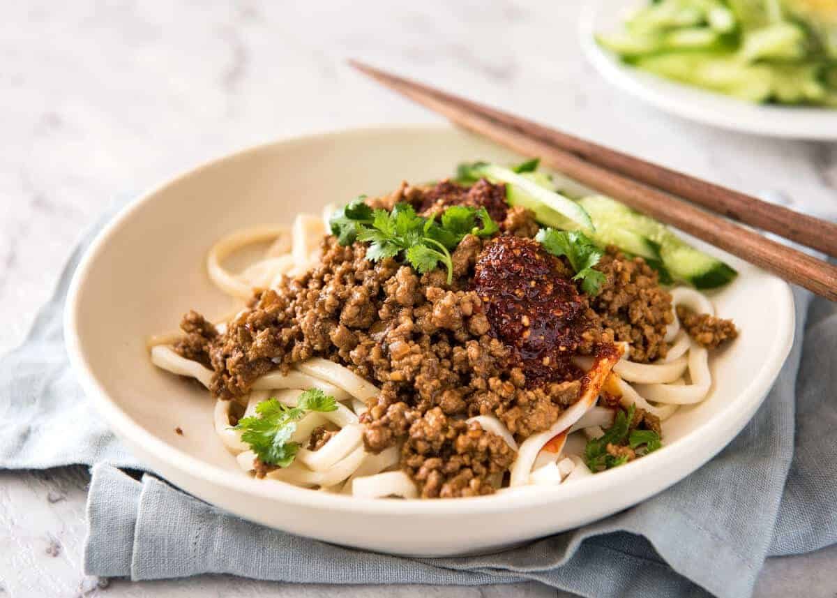 Chinese Pork with Noodles (Zha Jiang Mian) - Super quick and super tasty, affectionally known as "Chinese Bolognese". The pork is savoury with a touch of heat and spice, perfect mixed through noodles! www.recipetineats.com