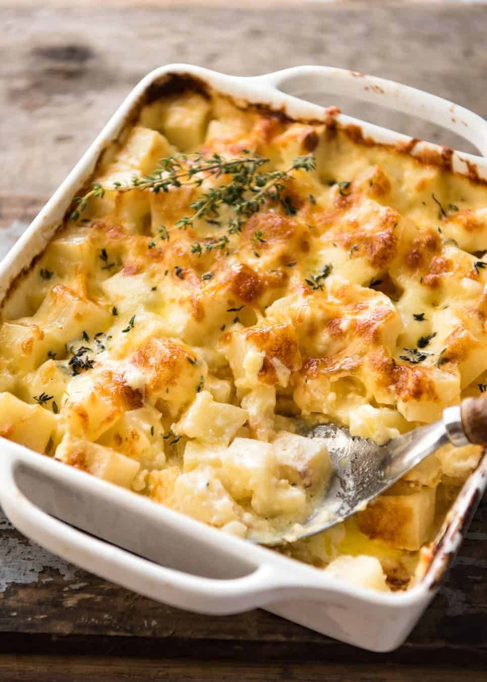 A faster, cheesier, creamier alternative to Scalloped Potatoes / Potato Gratin, this Easy Creamy Cheesy Potato Bake is made with cubed potatoes cooked in a cream and cheese sauce. www.recipetineats.com
