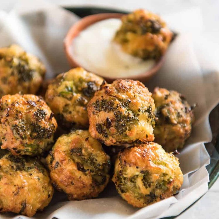 Baked Broccoli Cheese Balls - outrageously delicious as a meal or bites to serve at a gathering! Served with a Yoghurt Lemon Sauce. recipetineats.com