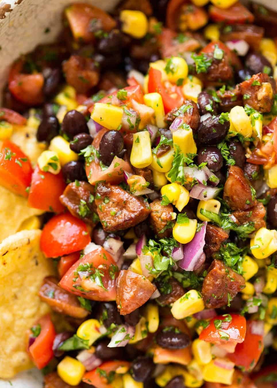 I call this a PIG OUT Salsa. Sensible people would call it an Chorizo, Black Bean and Corn Salsa. :) recipetineats.com