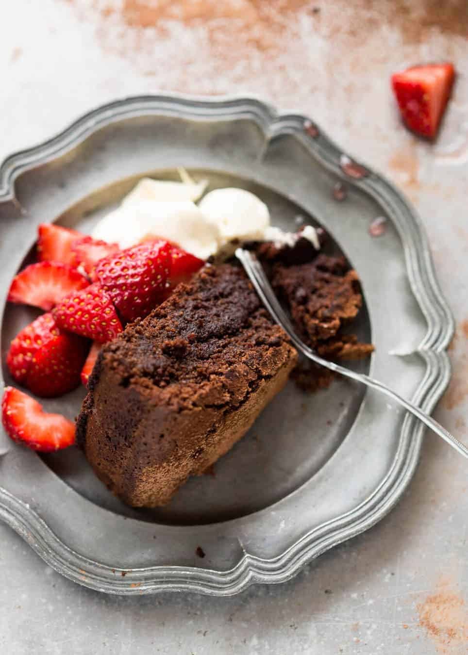 A simple Flourless Chocolate Cake made with almond meal / almond flour. Moist inside, with a thin crackly brownie-like surface. A stunning, very quick cake to make! www.recipetineats.com