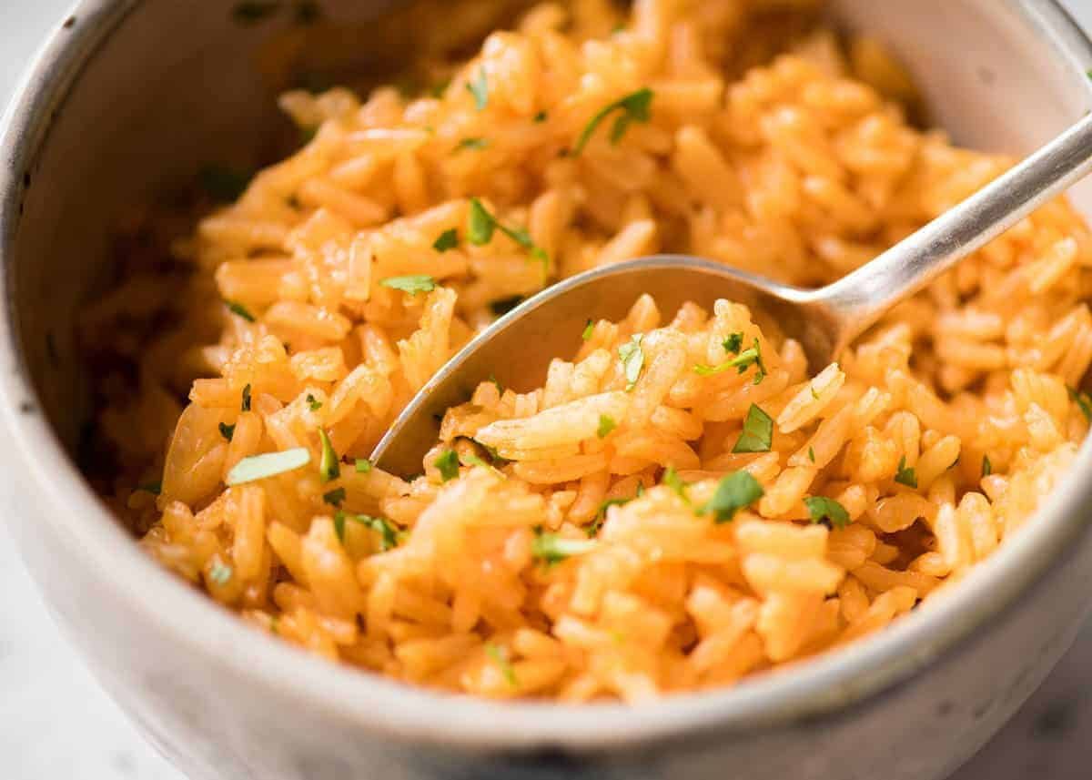 Fluffy, beautifully seasoned Mexican Red Rice (Arroz Rojo). Truly like what you get at restaurants! www.recipetineats.com