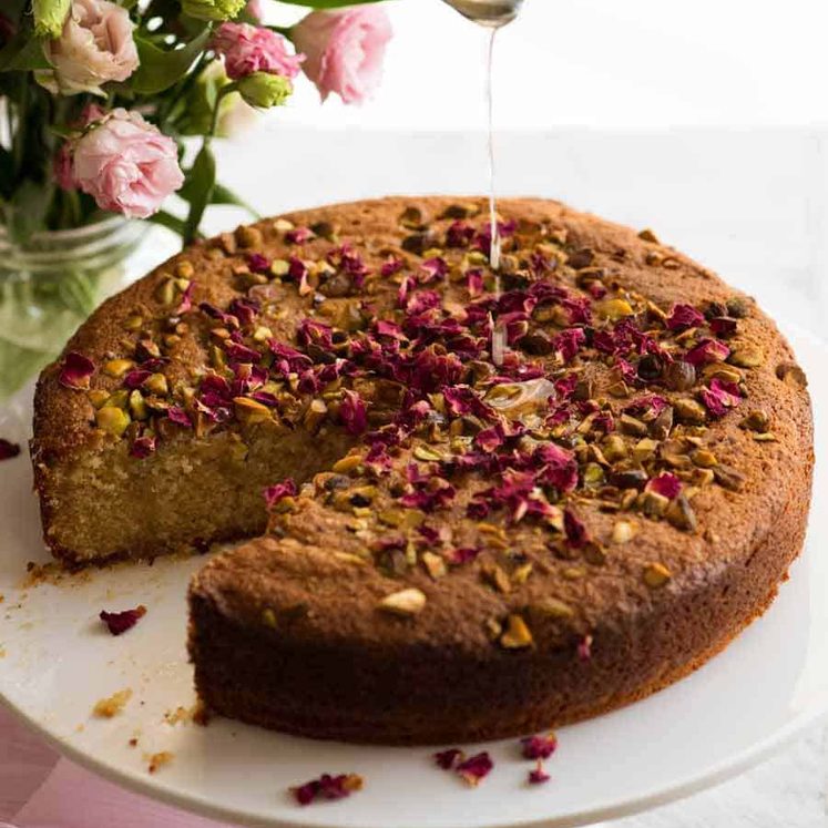 A Persian love cake decorated with rose petals