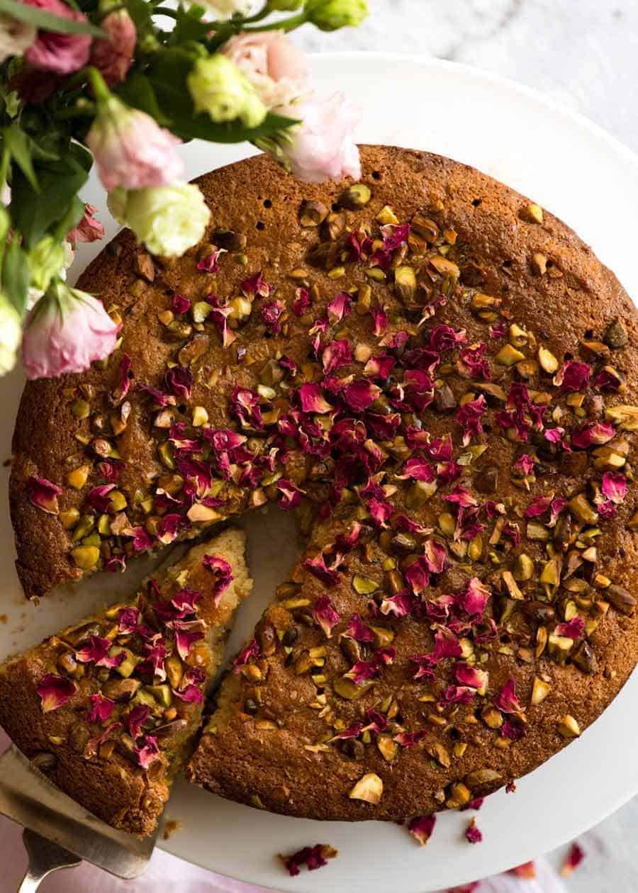 A beautiful Persian Love Cake, made with semolina and almond meal. The best part is pouring the syrup over the cake so it soaks all the way through!