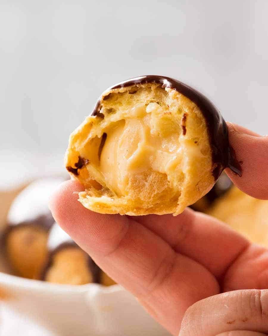 Close up showing the custard inside a profiterole