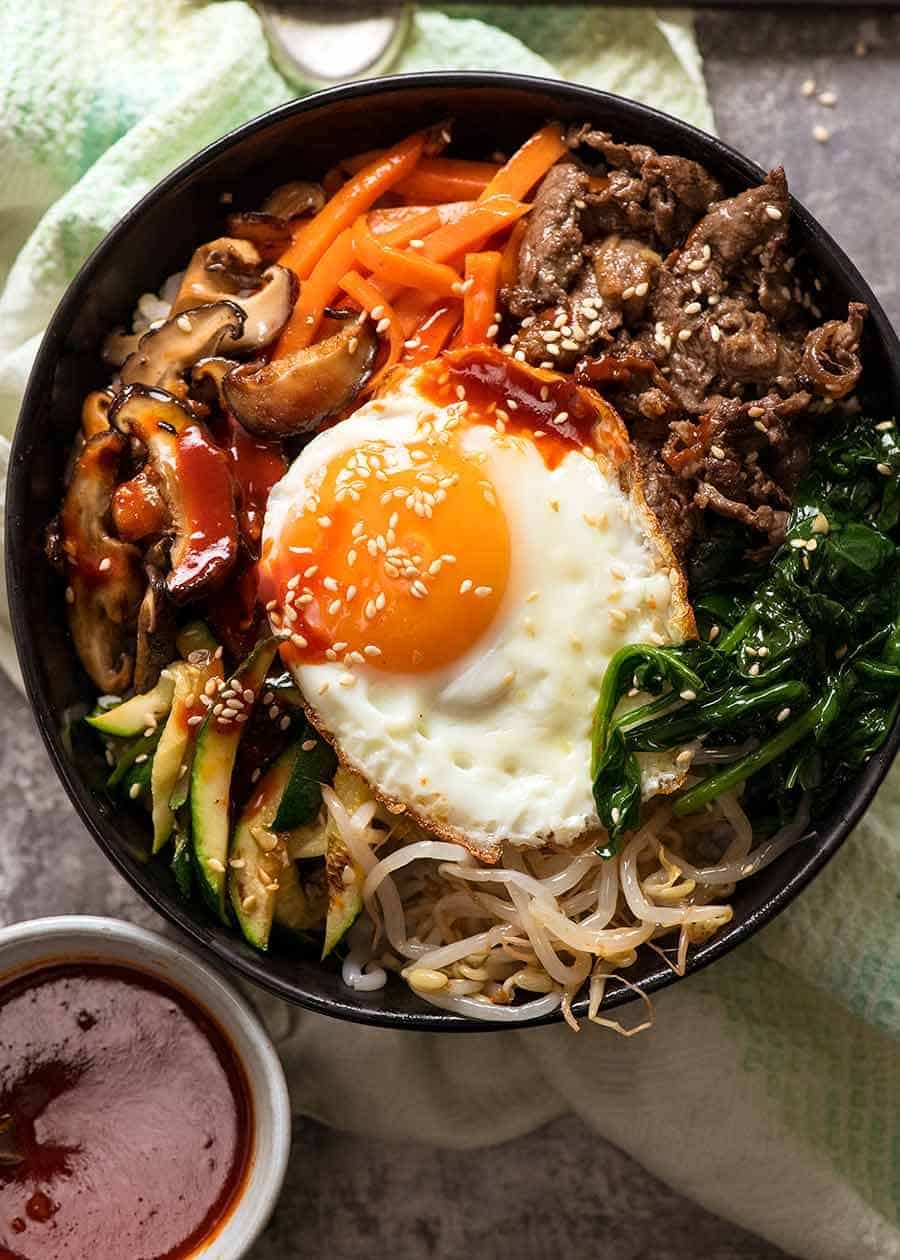 Overhead photo of Bibimbap, Korean Rice Bowl, ready to be eaten