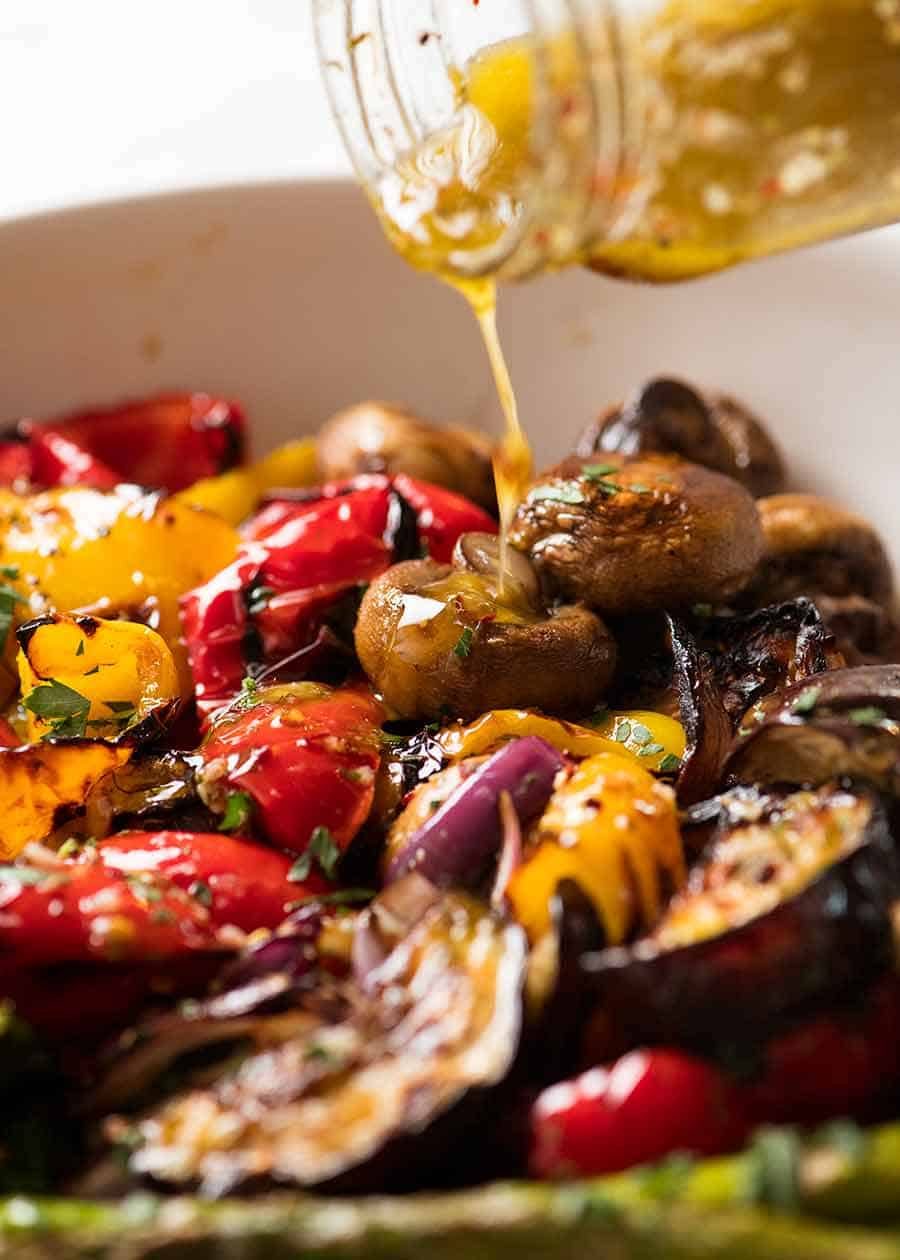 Pouring Marinade over grilled vegetables