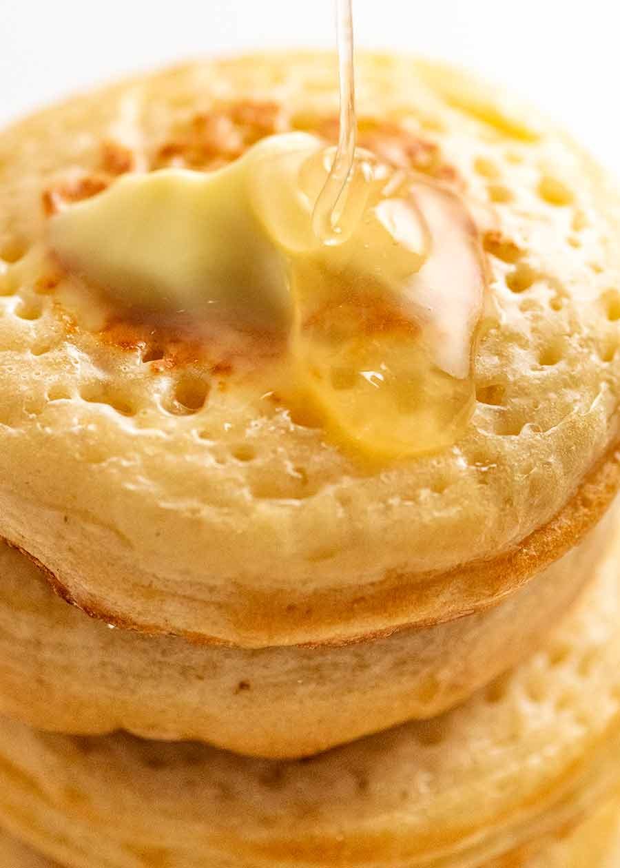 Drizzling butter on homemade crumpets