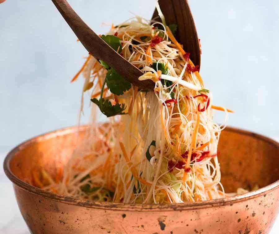 Vermicelli Noodle Salad being tossed in bowl