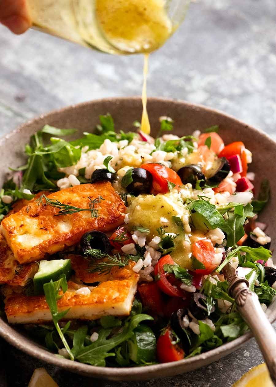 Drizzling lemon dressing over Brown Rice Salad