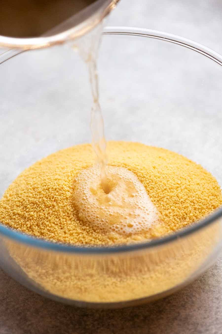 Pouring hot stock over Couscous