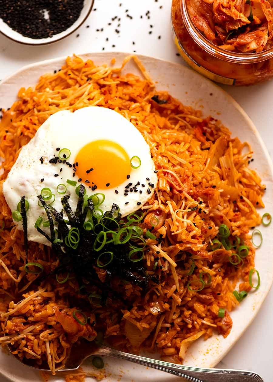 Plate of Kimchi Fried Rice topped with fried egg, ready to be served