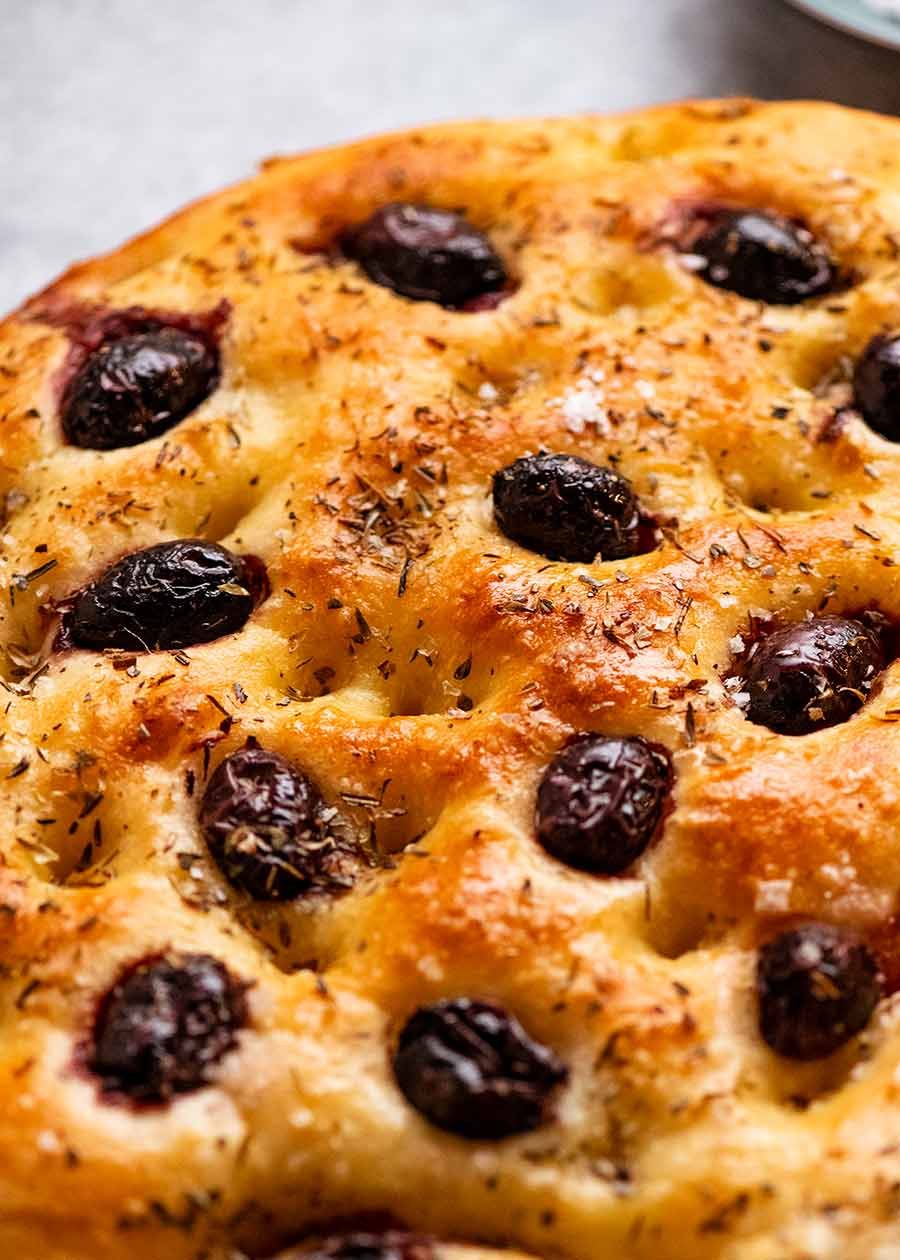 Freshly baked Olive Focaccia, ready to be sliced and served