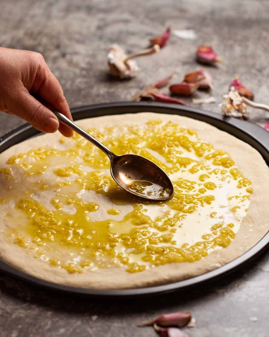 Making Garlic cheese pizza